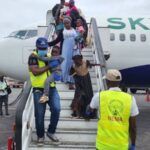 Nigerian returnees with some NEMA officials